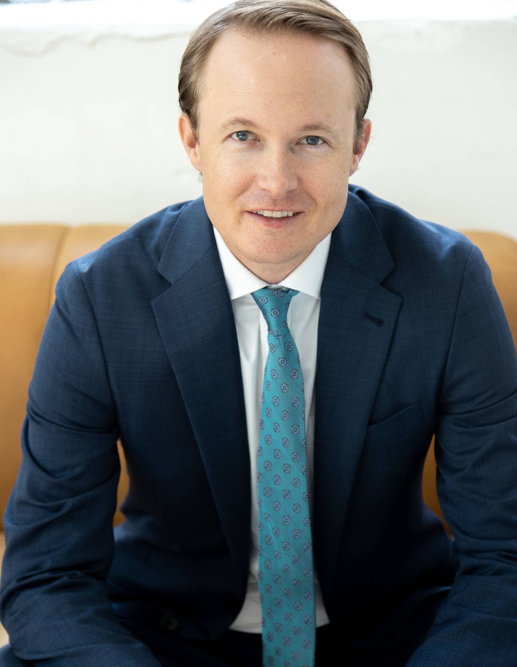 Professional headshot of businessman in suit