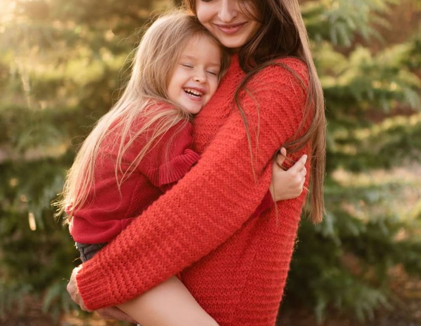 Woman in red blazer smiling